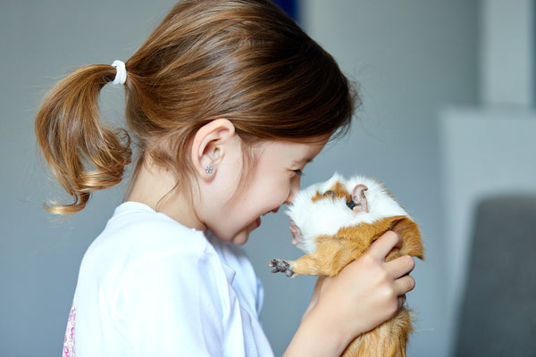 girl with her guinea pig